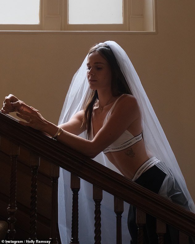 Clearly preparing for the moment she walked down the aisle, Holly also shared a pair of snaps in a bridal veil, while posing in a two-piece from Victoria's Secret Bridal