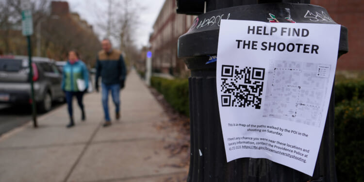 A poster seeking information about he campus shooting suspect at Brown University is seen on a lamppost in Providence, Rhode Island, on Dec. 17, 2025.