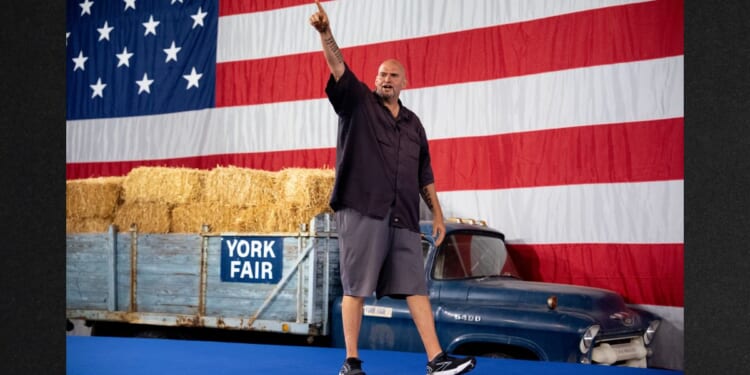 Sen. John Fetterman, a Pennsylvania Democrat, seen at an October 2024 rally for then-vice presidential nominee Minnesota Gov. Tim Walz, has frequently emerged as a voice of reason amid the increasingly contentious division between Democrats and Republicans