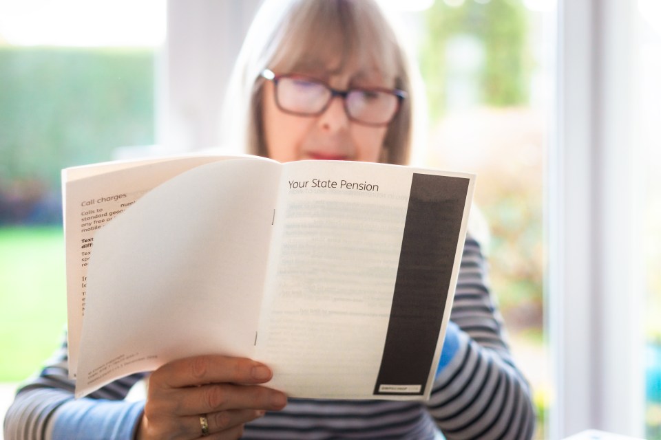 A senior woman in glasses reading a leaflet titled "Your State Pension."