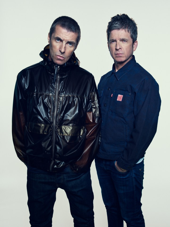 Liam and Noel Gallagher posing for a photo.