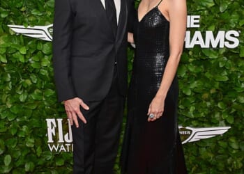 Hugh Jackman and girlfriend Sutton Foster didn't let the spotlight stop them from showing off their affection for one another