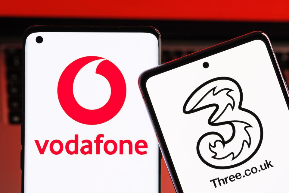 Vodafone and Three UK mobile operator logos displayed on smartphones.