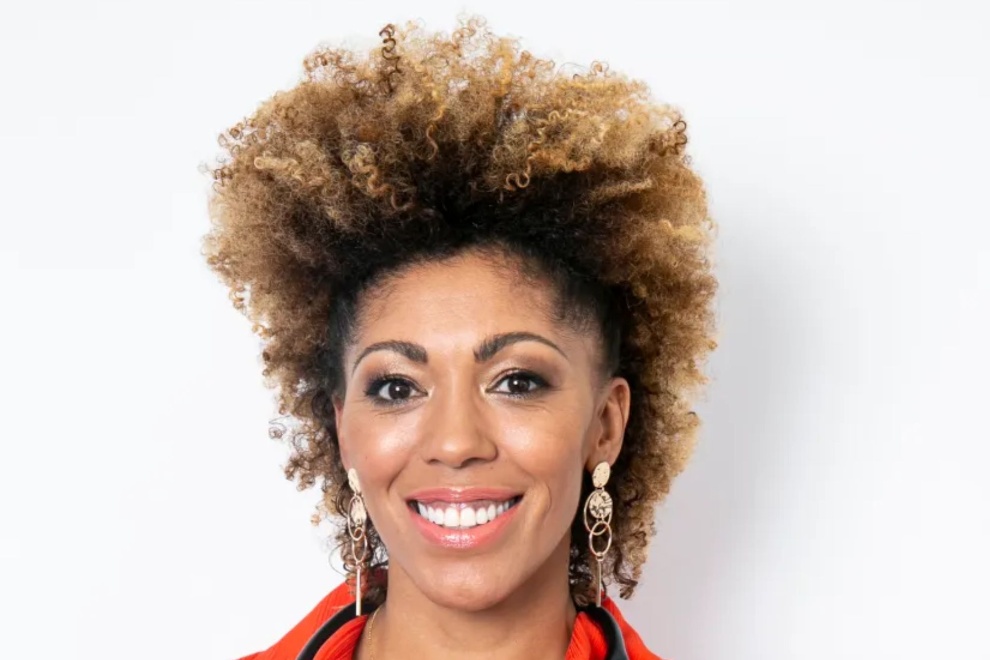 An image collage containing 1 images, Image 1 shows Portrait of a smiling woman doctor wearing a red shirt and blue pants