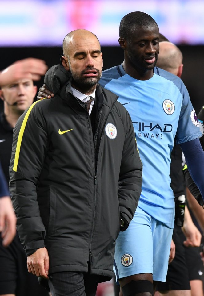 Manchester City manager Pep Guardiola and Yaya Toure after the game.