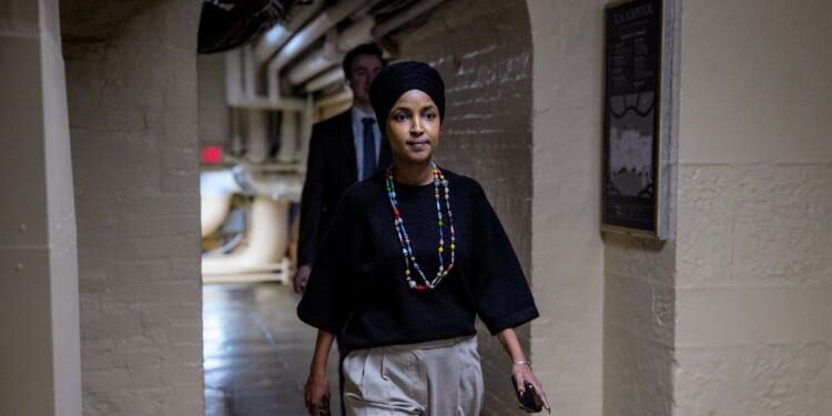 Rep. Ilhan Omar walks towards the U.S. Capitol Building on Dec. 10, 2025, in Washington, D.C.