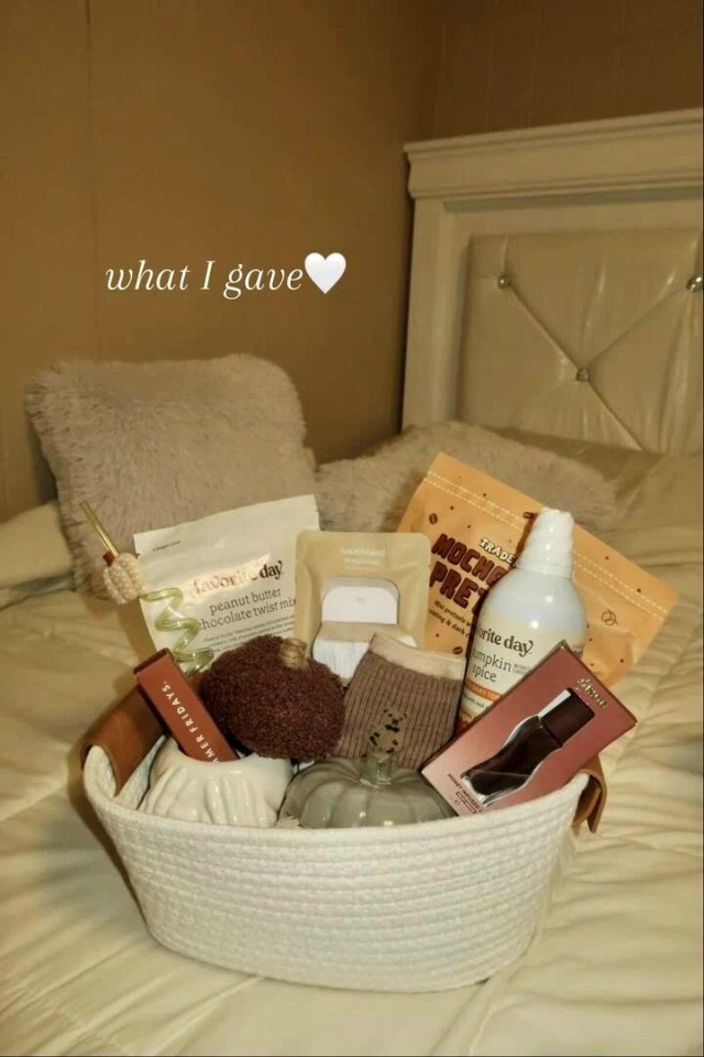 A gift basket filled with snacks, self-care items, and a pumpkin decoration.