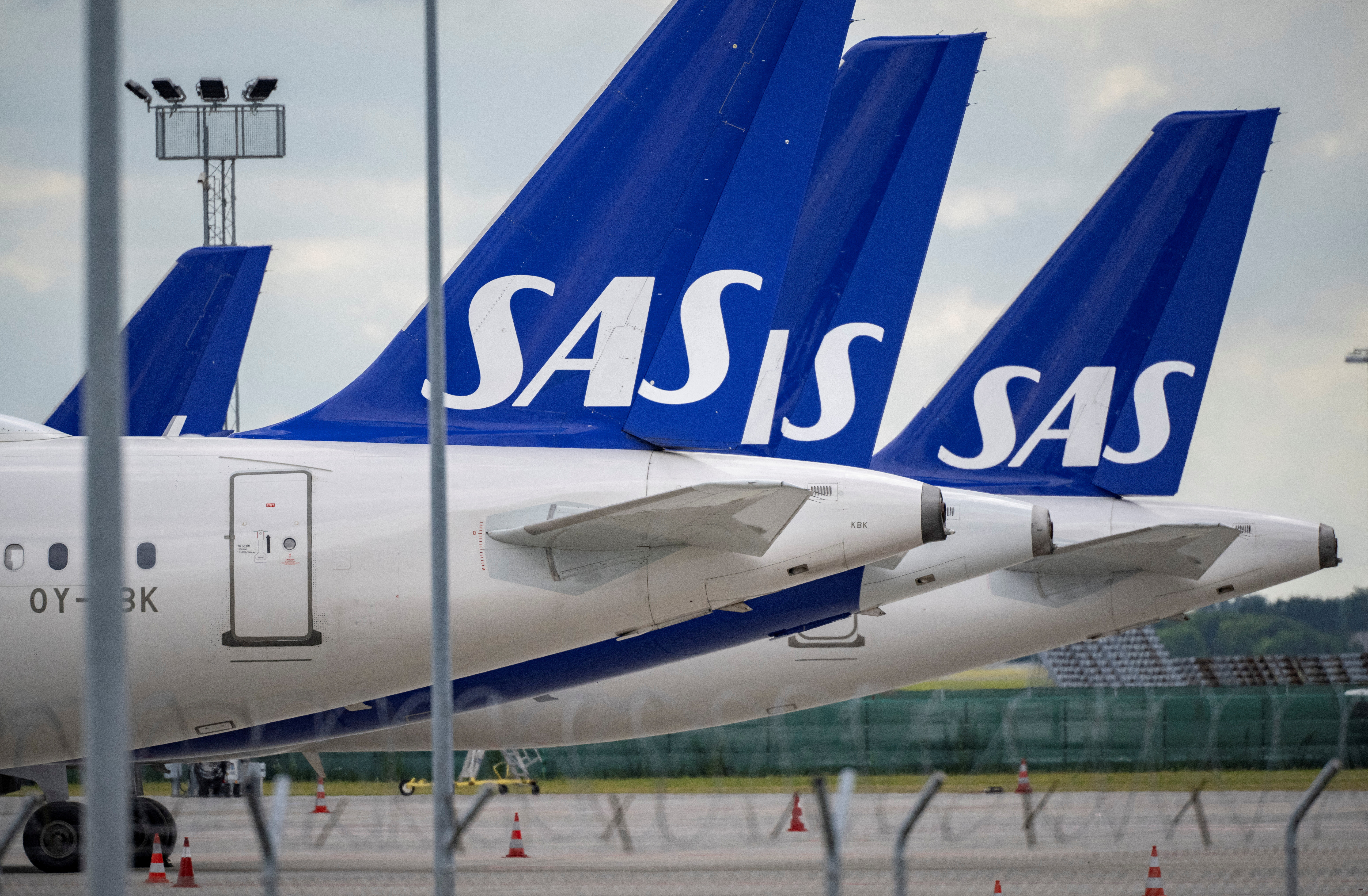 SAS Airbus A321 and A320neo aircraft parked on the tarmac at Kastrup Airport.