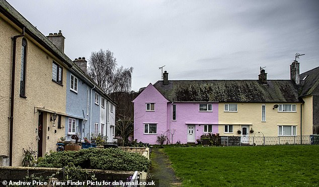 Locals described the vibrant road, in the popular seaside town of Beaumaris as the 'most beautiful estate'