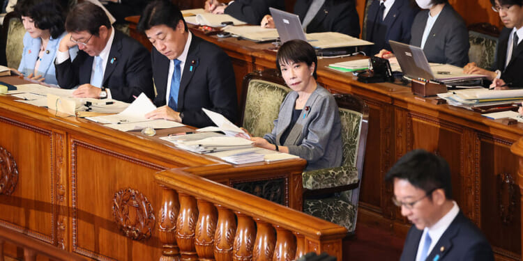 Japan’s PM promised to ‘work, work, work.’ For some, that’s a red flag.