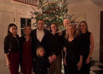 Online users were quick to point out that Joe Biden's Christmas Eve group photo had relegated the former US president to the background, with his face partially blocked by wife Jill