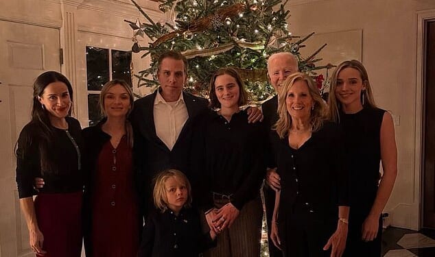Online users were quick to point out that Joe Biden's Christmas Eve group photo had relegated the former US president to the background, with his face partially blocked by wife Jill