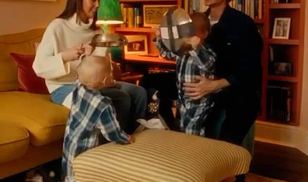 The mother (pictured) gleefully opens the presents while declaring 'You know we needed frying pans,' as she thanks the children for the gifts