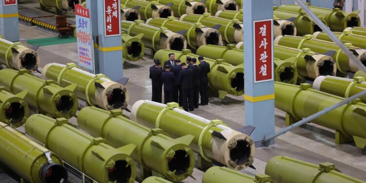 Kim Jong-un demands more missiles as he orders weapons factories to pick up pace after taking daughter to see nuke sub