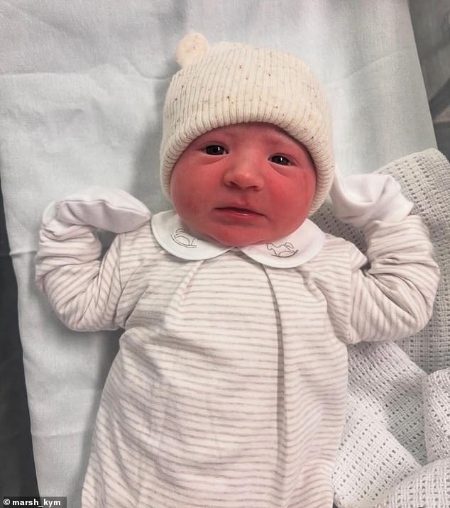 In one close-up of Bobby, he looks heart-melting in a striped onesie with a collar and a cream beanie