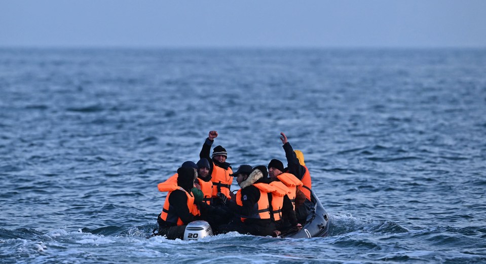 Migrants in an inflatable boat crossing the English Channel.