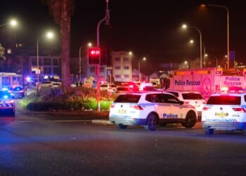 Police cars were seen parked at the scene of a mass shooting that took place at Bondi Beach on Dec. 14, 2025 in Sydney, Australia.