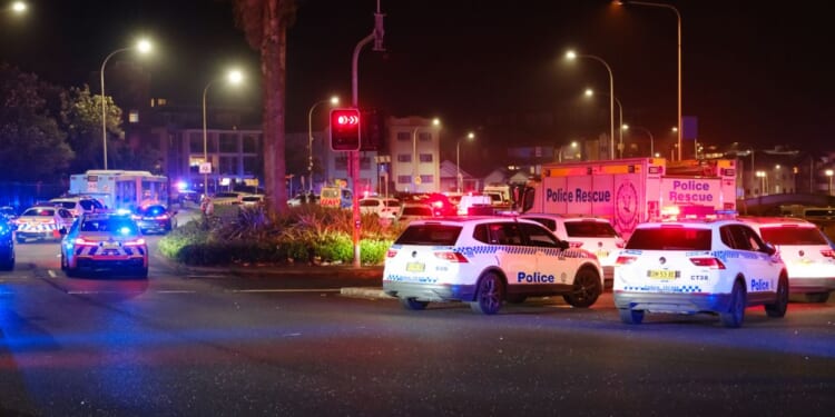 Police cars were seen parked at the scene of a mass shooting that took place at Bondi Beach on Dec. 14, 2025 in Sydney, Australia.