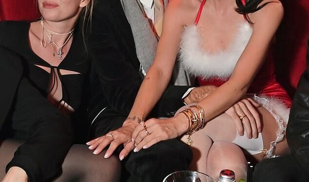 Lily Allen was pictured sharing a kiss with Jonah Freud at her Christmas party in London on Friday night as she wore the ultimate revenge dress (L to R: Jordan Hewson, Jonah Freud)