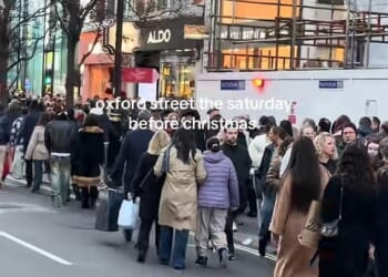 Videos shared on social media show shoppers packed shoulder-to-shoulder as they try to make their way down Oxford Street