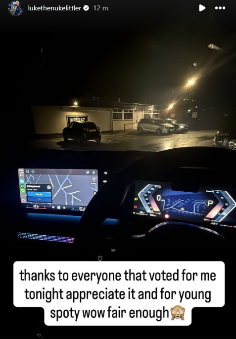Driver's view from inside a car at night, showing the dashboard and navigation screen, with a parking lot and building visible outside through the windshield, overlaid with a text bubble thanking voters.