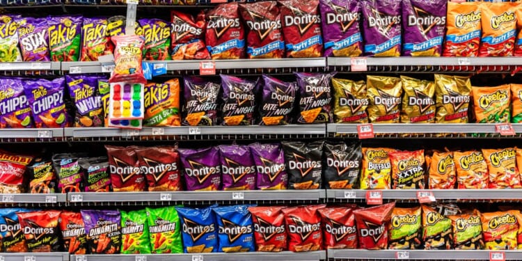 Bags of Doritos and chips on the shelves of a Walmart store in Florida City, Florida, on Aug. 5, 2025.