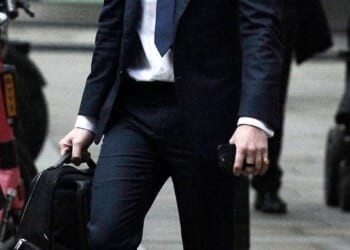 Lonan O'Herlihy, known as the 'Posh PT', pictured outside London's High Court where he is suing his mother's ex-boyfriend's widow for a share of his £38million estate