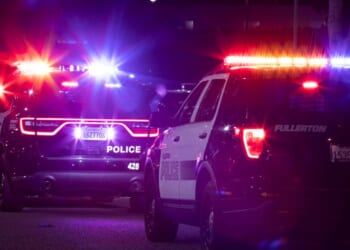 Fullerton Police Department units respond to the scene of a nighttime emergency on Dec. 11, 2022.