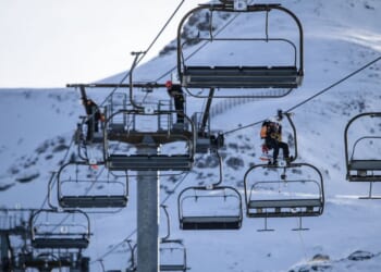 Ski lift operators practicing emergency response drills on a line of chairlift pylons at La Pierre Saint Martin in Arette, France, on Dec. 1, 2025.
