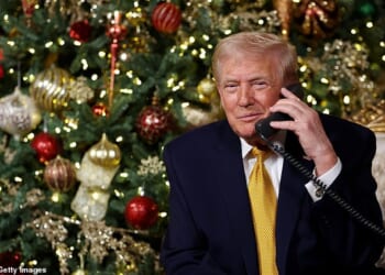 U.S. President Donald Trump calls children as he participates in tracking Santa Claus' movements with the North American Aerospace Defense Command (NORAD) Santa Tracker on Christmas Eve on December 24, 2025 in Palm Beach, Florida.