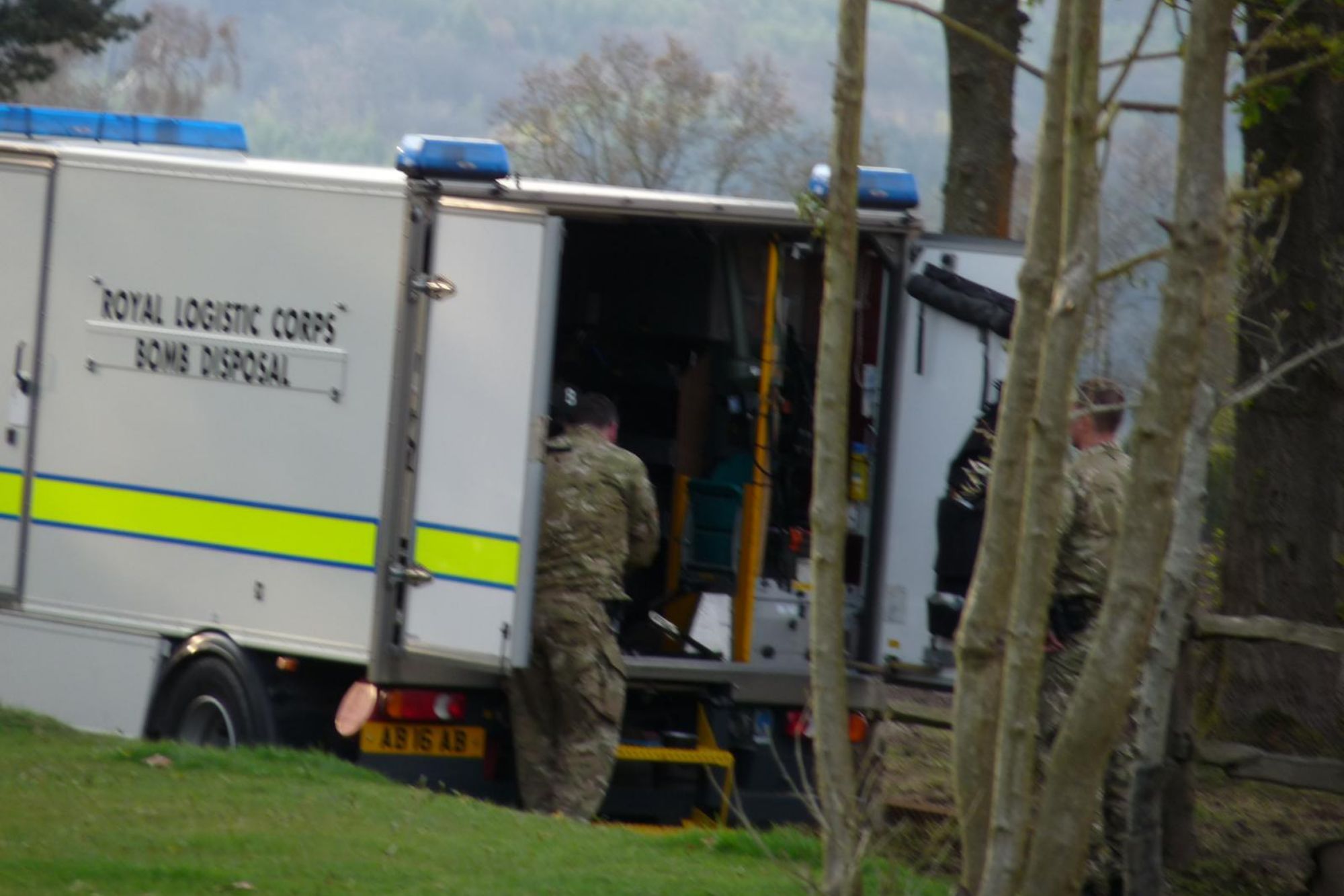 An image collage containing 1 images, Image 1 shows Royal Logistic Corps Bomb Disposal vehicle with two soldiers