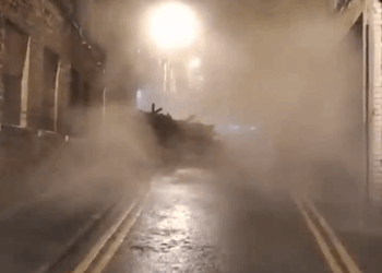 Moment building COLLAPSES in UK city centre yards from passersby as huge cloud of smoke billows