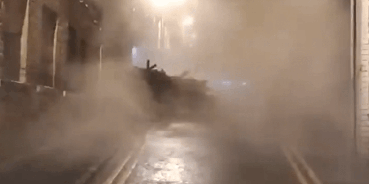 Moment building COLLAPSES in UK city centre yards from passersby as huge cloud of smoke billows