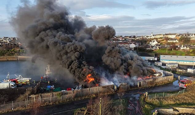A fire that caused a huge explosion caused plumes of thick black smoke to billow over Methil Harbour in Scotland