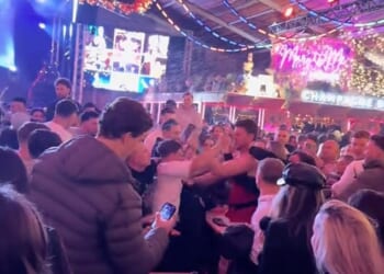 Footage uploaded to TikTok shows two males throwing punches at each other inside the Winter Wonderland's packed Bavarian Village in London's Hyde Park