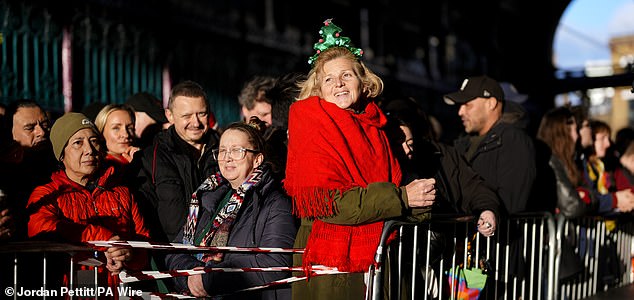 People attend the Smithfield Market Christmas meat auction in the City of London, as traders auction off their surplus meats to the public in a tradition that spans back a century. Picture date: Wednesday December 24, 2025. PA Photo. Photo credit should read: Jordan Pettitt/PA Wire