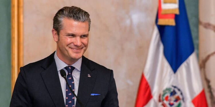 Secretary of Defense Pete Hegseth smiles during a press conference at the Dominican National Palace in Santo Domingo on Nov. 26, 2025.