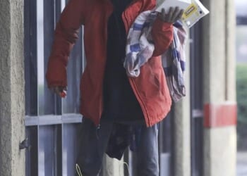 Former Nick child star Tylor Chase is now receiving medical care after shocking fans with viral videos of him living on the street, the Daily Mail has learned; pictured Wednesday on a rainy Christmas Eve in Southern California