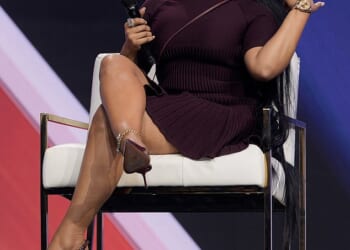 Nicki Minaj suffered an embarrassing gaffe in front of Erika Kirk as she attempted to praise JD Vance as an 'assassin' while speaking with Charlie Kirk's widow at Turning Point USA's AmFest on Sunday