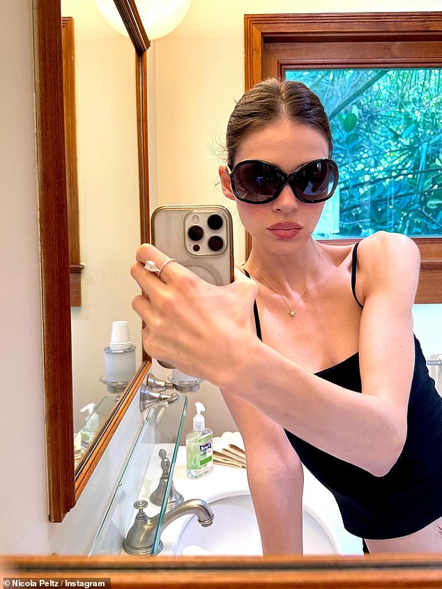 Nicola also posted a selfie sporting a pair of huge black sunglasses with a caption revealing her favourite place to be