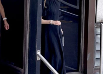 Nicole Kidman cut a solemn figure as she stepped out alone for Christmas morning mass in North Sydney on Thursday