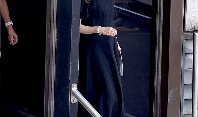 Nicole Kidman cut a solemn figure as she stepped out alone for Christmas morning mass in North Sydney on Thursday