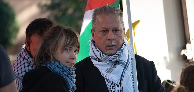 Mohammad Hannoun, the president of the Palestinian Association in Italy, (pictured, right) was photographed with Greta Thunberg (pictured, left) at a pro-Palestine rally in Rome in November