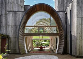 Th spectacular full height circular stone entrance greets visitors to the house