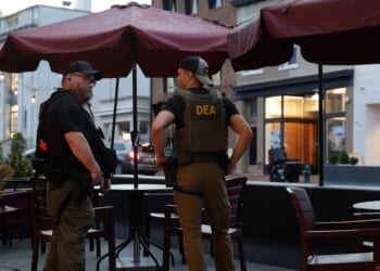 Drug Enforcement Administration personnel patrol M Street in Georgetown on Aug. 13, 2025, in Washington, D.C.