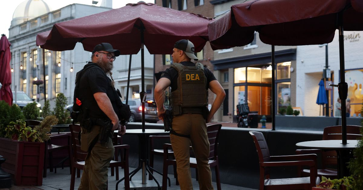 Drug Enforcement Administration personnel patrol M Street in Georgetown on Aug. 13, 2025, in Washington, D.C.