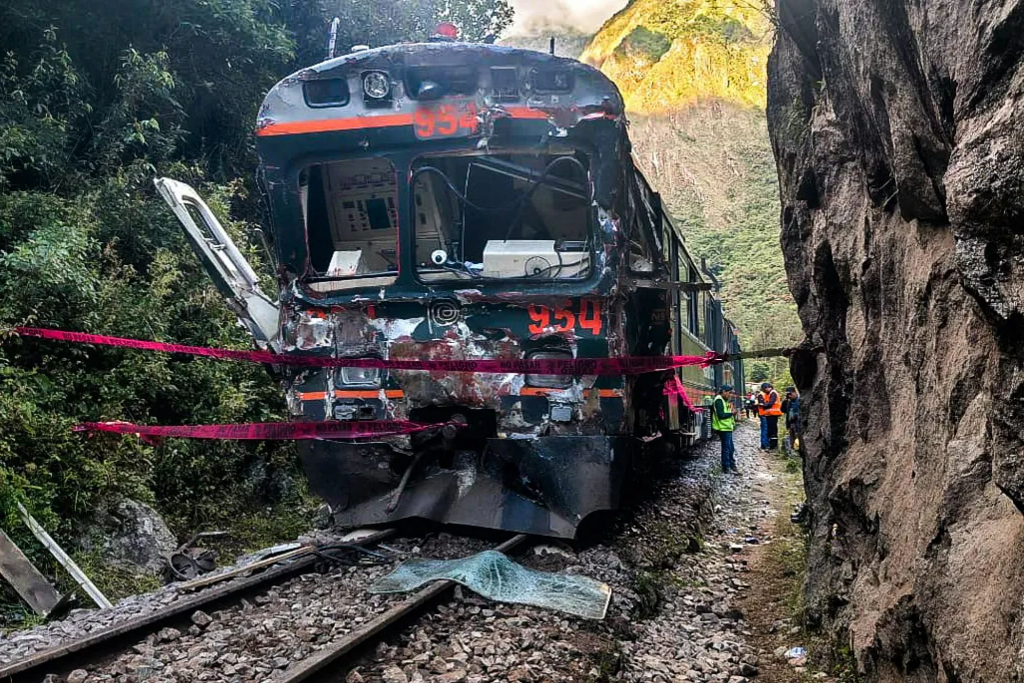 An image collage containing 1 images, Image 1 shows Damaged train from a head-on collision near Machu Picchu, Peru