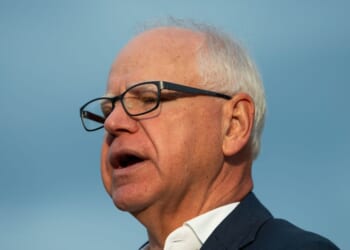Minnesota Gov. Tim Walz speaks to reporters at Deerwood Elementary in Eagan, Minnesota, on Sept. 2, 2025.