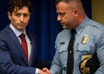 Minneapolis Police Chief Brian O'Hara shakes hands with Minneapolis Mayor Jacob Frey after he addressed the findings of a Justice Department investigation into the Minneapolis Police Department during a press conference in Minneapolis, Minnesota, on June 16, 2023.