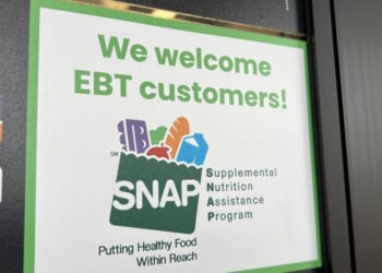 Sign at supermarket entrance with text reading We Welcome EBT customers and a SNAP logo in Lafayette, California, on Nov. 13, 2025.